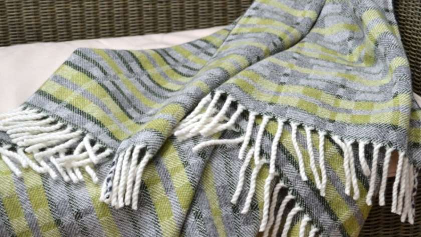Handwoven 'Dukagang Stripe' lambswool throw in apple green, mid grey and dark green