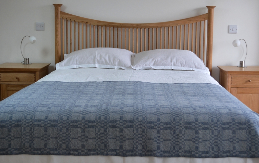 Soft blue 'Coverlet' throw on bed