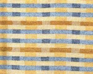 Lineal Opposites throw in shades of yellow ochre and grey