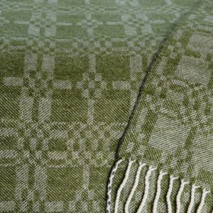 Close up of 'Coverlet' design in dark apple