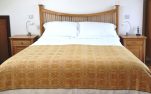 Coverlet throw in yellow ochre