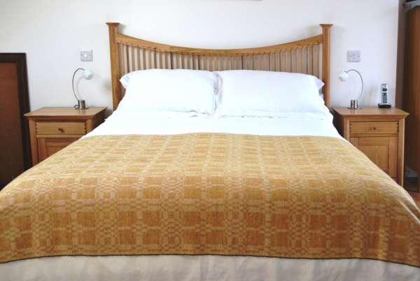 Coverlet throw in yellow ochre