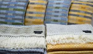 Lineal and Lineal Opposites cushions at the back and Hardanger blanket shawls to the fore.