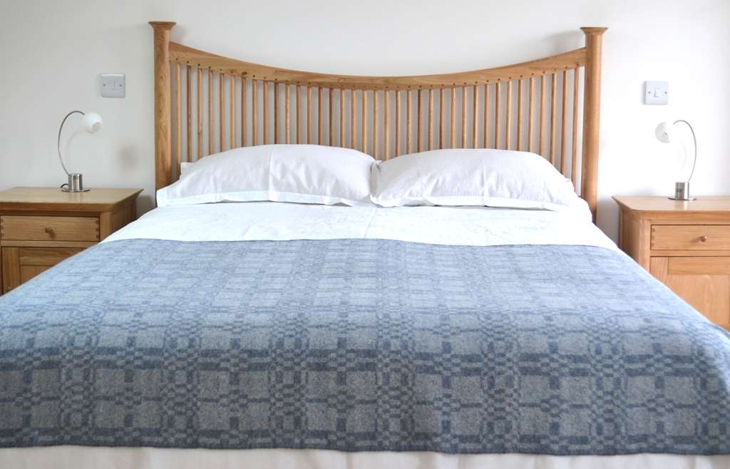 Coverlet throw in soft blue