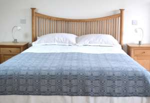 Coverlet throw in soft blue