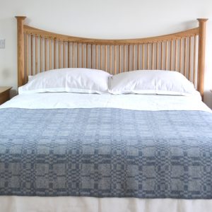 Coverlet throw in soft blue
