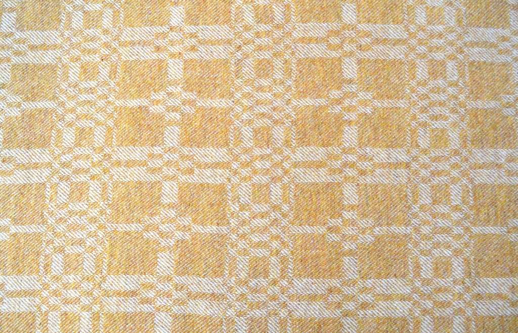 Coverlet throw in yellow ochre - side 1